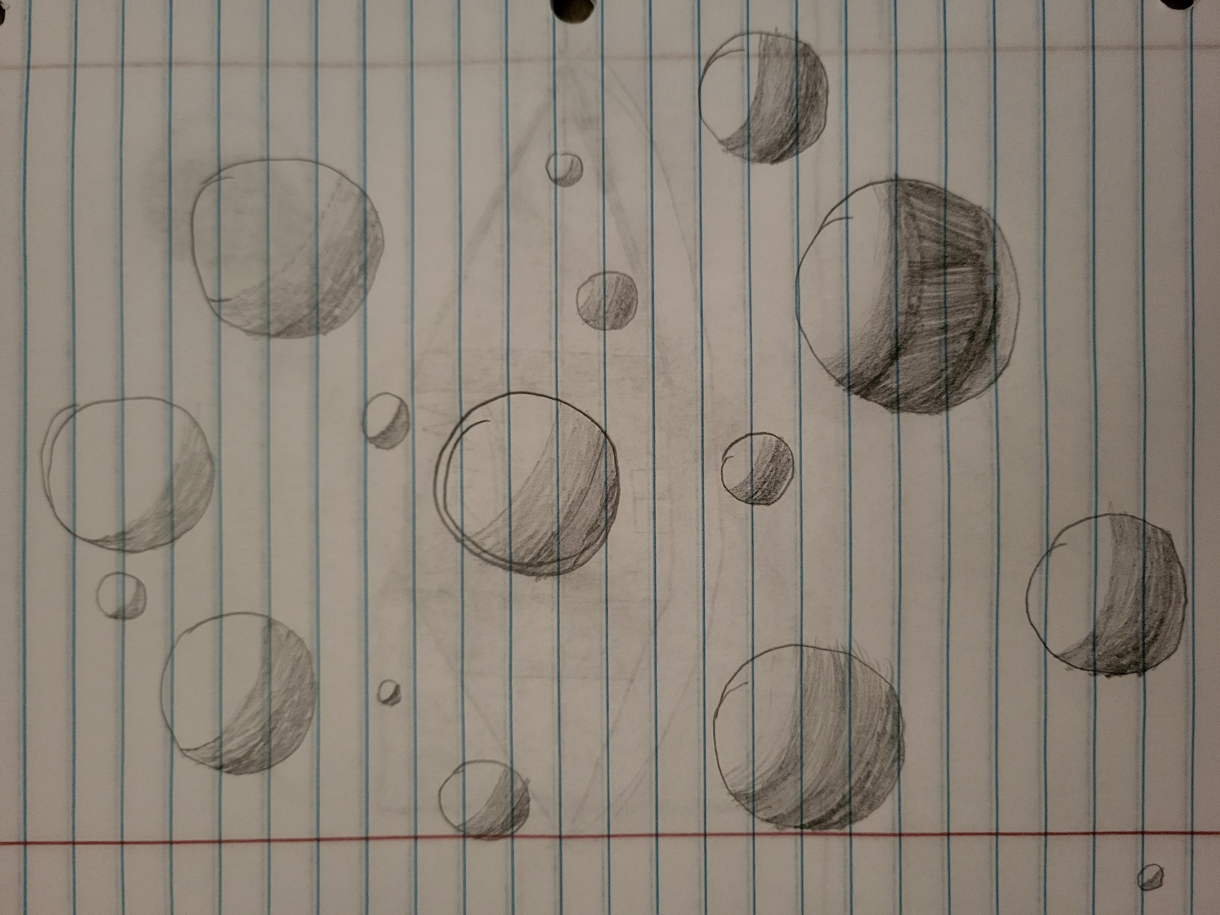 A drawing of numerous shaded circles.